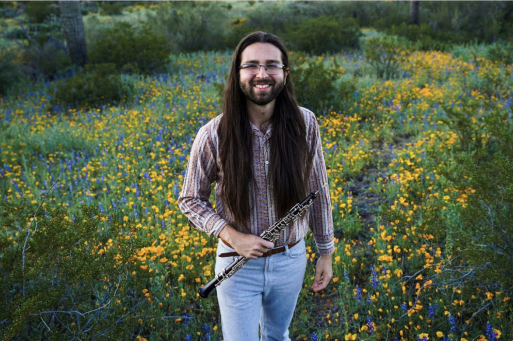 Chris Zatarain: Creating music to tell environmental stories. Chris with his instrument in nature.