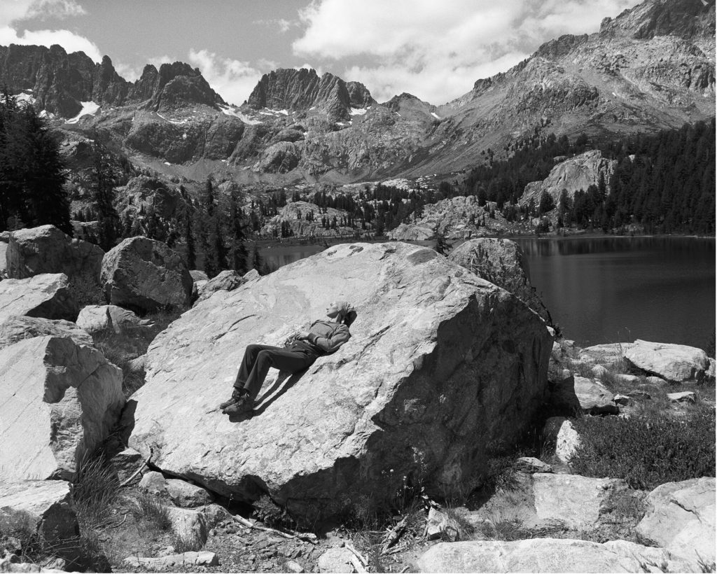 Betsy, Lake Ebiza ... a black-and-white photograph of a woman lying on a rock
