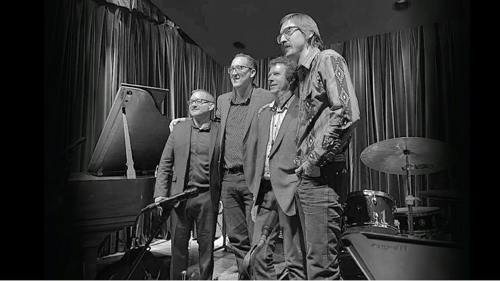 University of Arizona Faculty Ensemble ... four musicians posing together on stage.