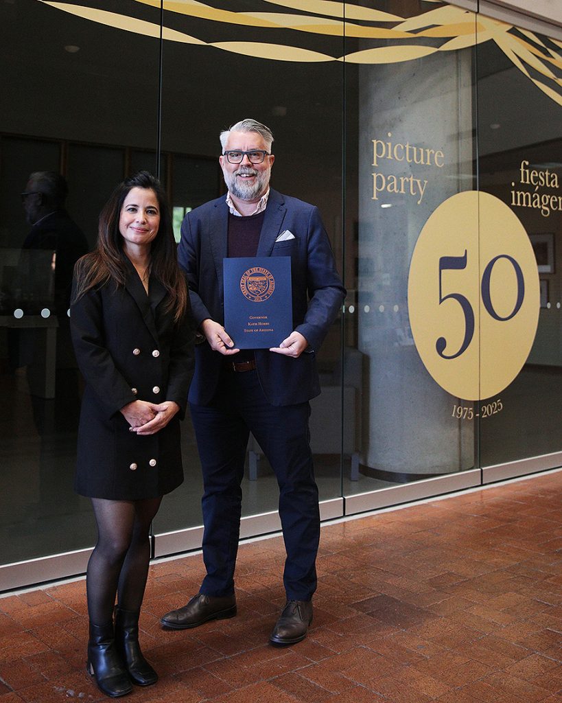 Regional Outreach Coordinator Selina Valenzuela of the Governor’s Southern Arizona office presents the governor's commendation to CCP Director Todd Tubutis at the center today